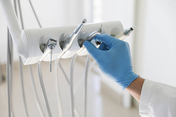 Professional Tooth Extraction technician working in Atlantis, FL